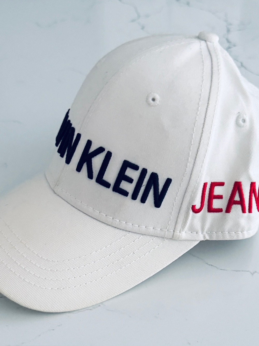Calvin Klein White Baseball Cap with Black and Red Logo